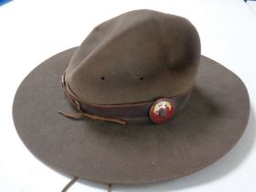 A vintage scouting hat (size six and five eighths) with enamelled boy scout bag