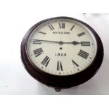 An early 20th century circular station wall timepiece with enamel dial, signed Potts & Sons LNER,
