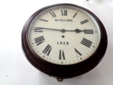 An early 20th century circular station wall timepiece with enamel dial, signed Potts & Sons LNER,