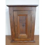 An antique continental oak hanging wall cabinet