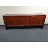 A Skovby teak sliding door low sideboard