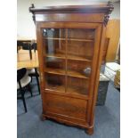 A 19th century continental mahogany and pine glazed door bookcase