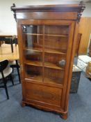 A 19th century continental mahogany and pine glazed door bookcase