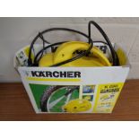 A Karcher K 090 pressure washer with hose and attachments (boxed)