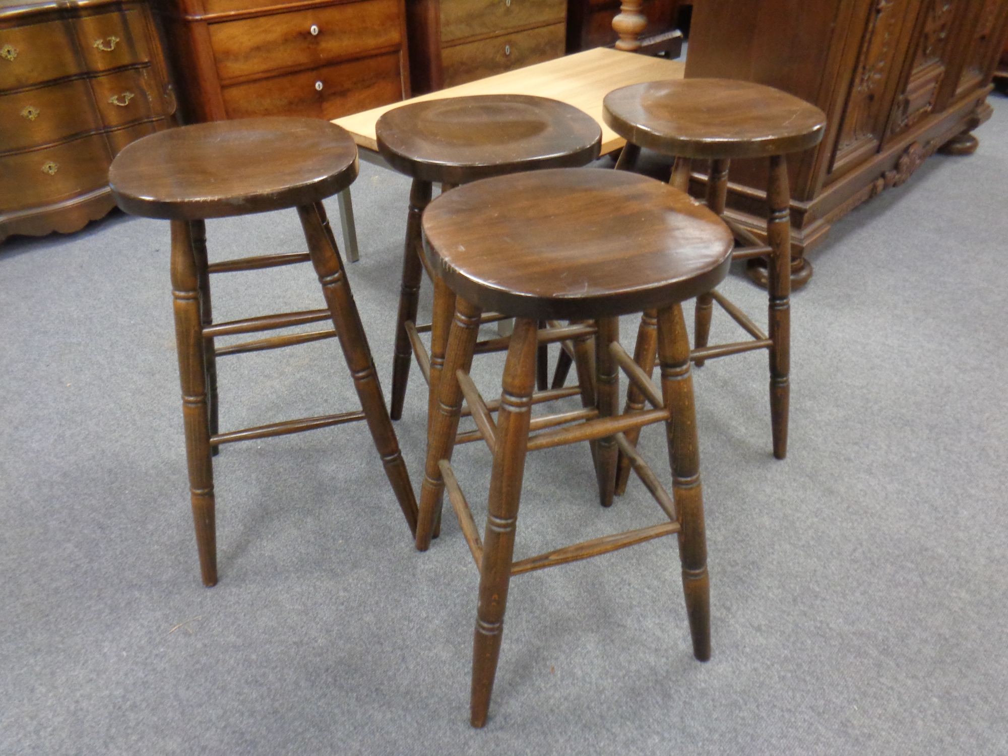 A set of four beech bar stools