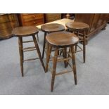 A set of four beech bar stools