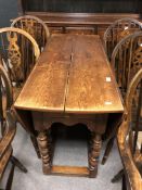 An oak barley twist drop leaf dining table