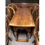 An oak barley twist drop leaf dining table