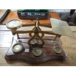 An antique set of postal scales with brass weights