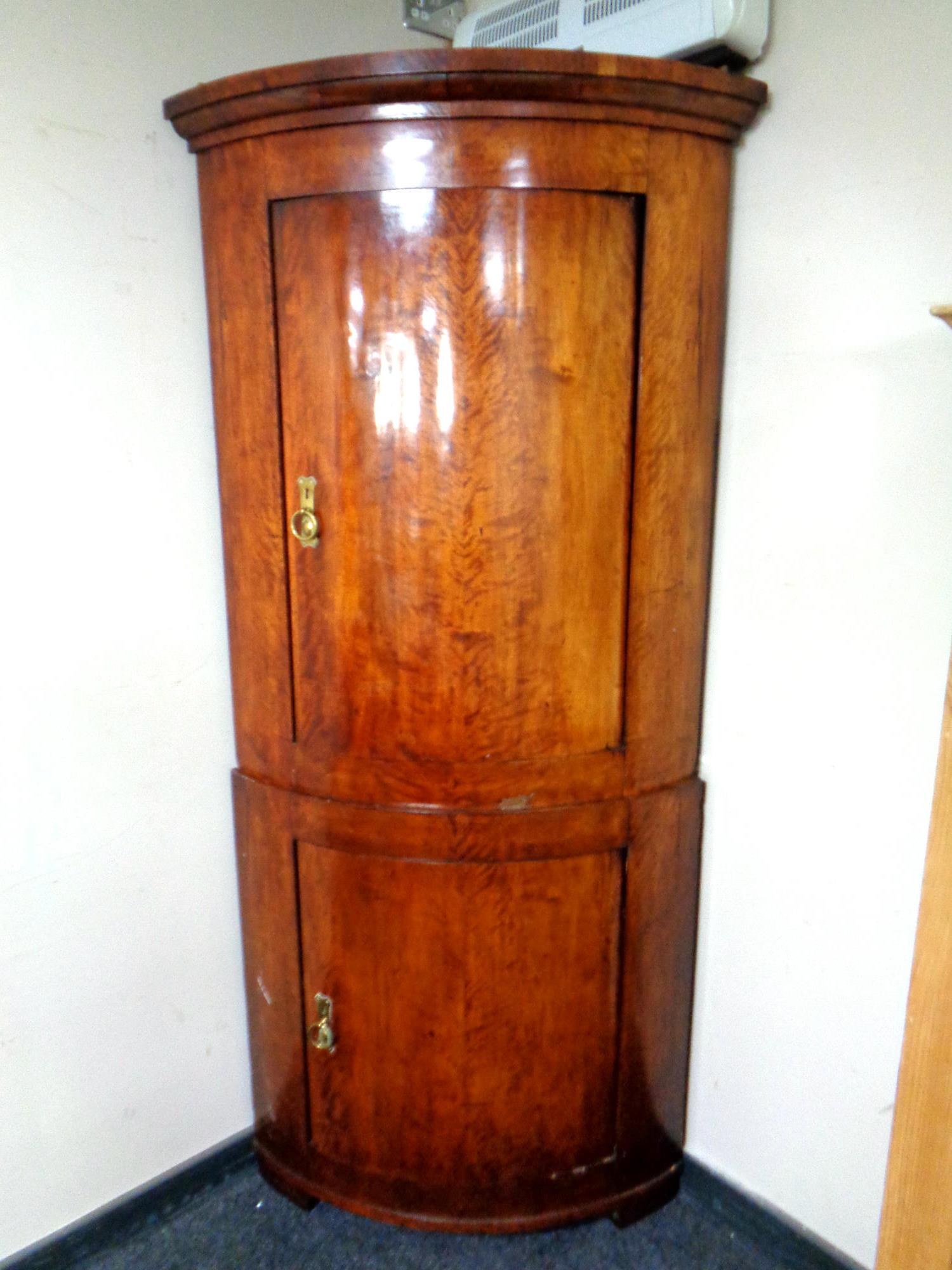 A continental beech bow front corner cabinet (AF)