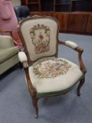 A 19th century continental beech salon chair in tapestry fabric