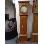 A continental pine longcase clock with painted dial,