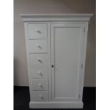 A contemporary white painted wardrobe fitted with six drawers