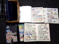 A box of eight albums of world stamps