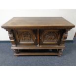 A 19th century carved oak low cabinet