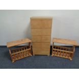 A contemporary oak effect chest with a pair of magazine racks