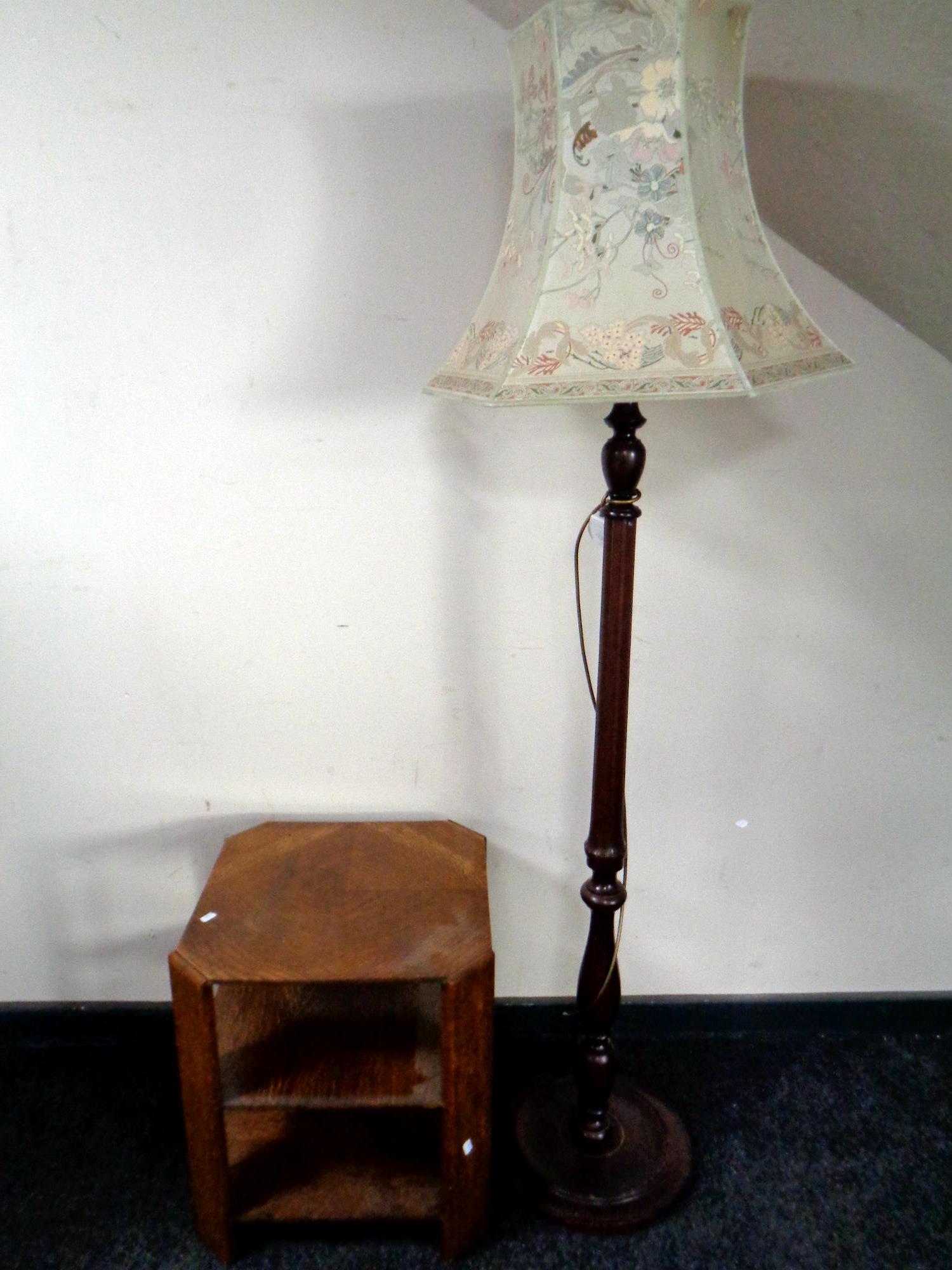 A stained beech standard lamp together with an oak book table