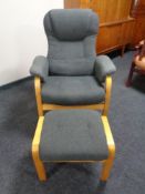 A beech framed armchair with matching footstool in grey upholstery