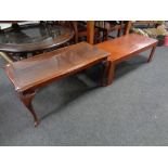 A mahogany glass topped coffee table together with a further low table