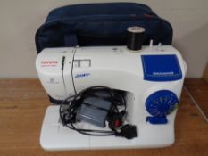 A Toyota Jeans electric sewing machine with foot pedal in carry bag