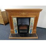 A contemporary electric fire insert in pine surround