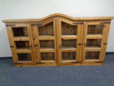A pine four door dome topped bookcase top