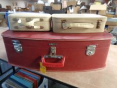 A vintage Coronet luggage case containing two smaller cases