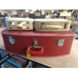 A vintage Coronet luggage case containing two smaller cases