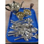 A tray of three piece silver plated tea set and unboxed stainless steel cutlery