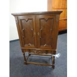 A continental oak two door cabinet