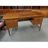 A continental teak desk fitted with six drawers