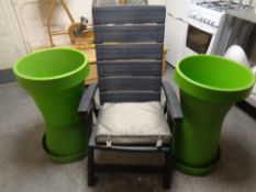 A folding plastic garden armchair together with two plastic garden planters