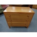 A 20th century teak three drawer chest