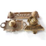 Three ornate brass inkwells