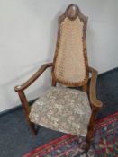 A beech armchair with rattan backrest and tapestry upholstered seat