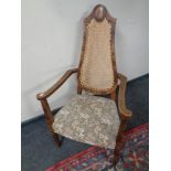 A beech armchair with rattan backrest and tapestry upholstered seat
