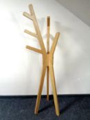 A contemporary oak veneered hat and coat stand