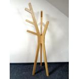 A contemporary oak veneered hat and coat stand