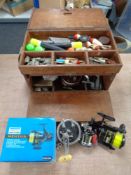 A quantity of fishing equipment including a fishermans box containing Penn and other reels,