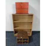 Contemporary open low bookshelf with a collectors cabinet and four door index chest