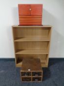 Contemporary open low bookshelf with a collectors cabinet and four door index chest