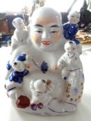 A Chinese export porcelain Buddha group