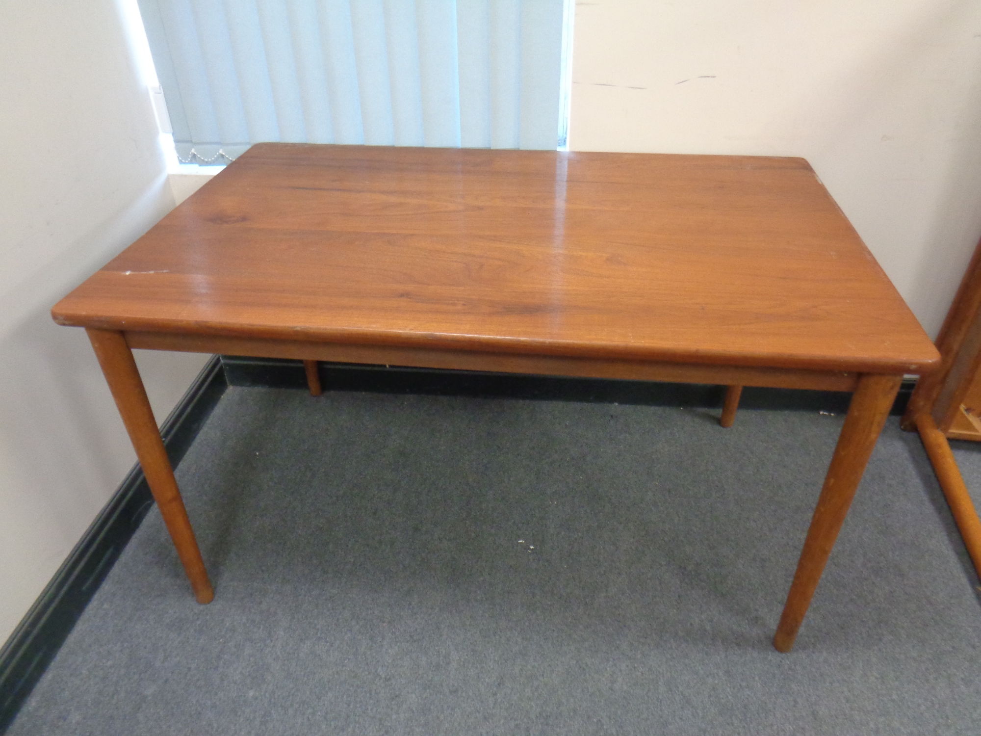 A 20th century teak rectangular dining table