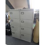Two Triumph four-drawer metal filing cabinets with keys