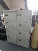 Two Triumph four-drawer metal filing cabinets with keys