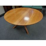 A circular pine low coffee table