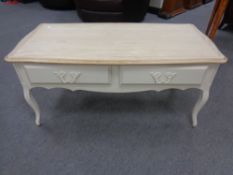 A Laura Ashley painted oak two drawer low coffee table on cabriole legs