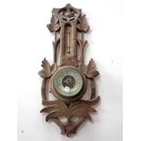A carved wooden barometer