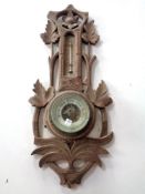 A carved wooden barometer