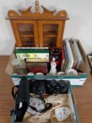 Two boxes containing miscellanea including commemorative chine, 20th century annuals, binoculars,
